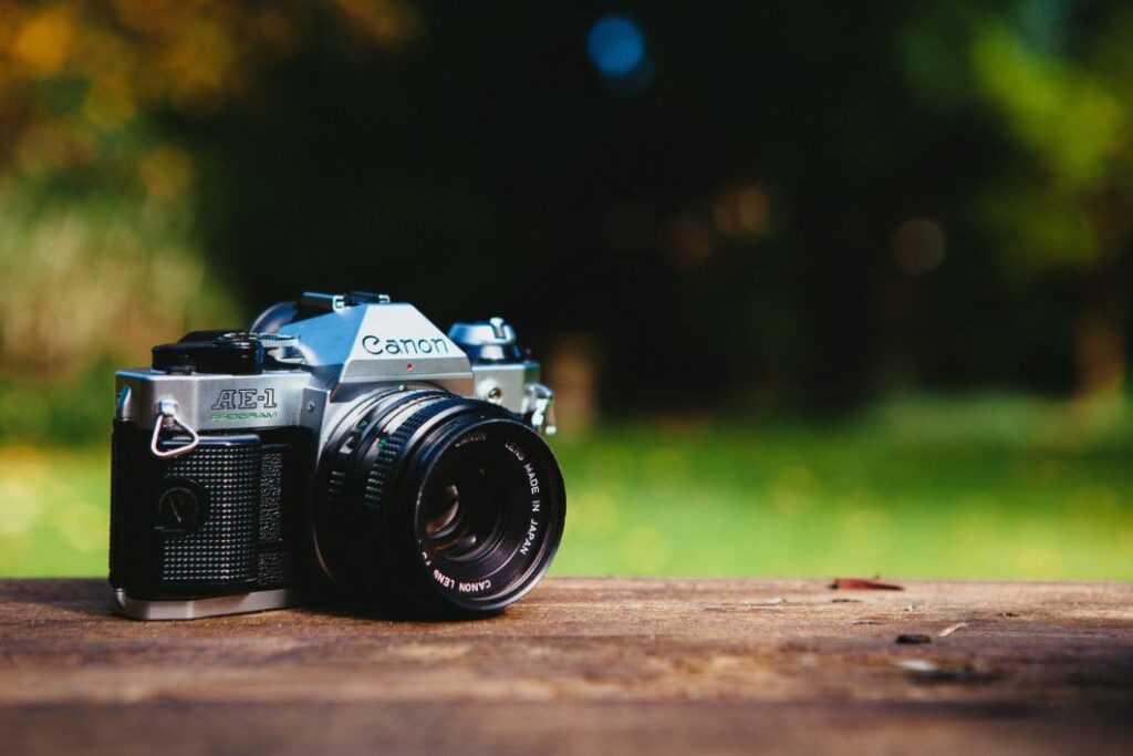 Camera on Wood Shelf Free Stock HD Photo