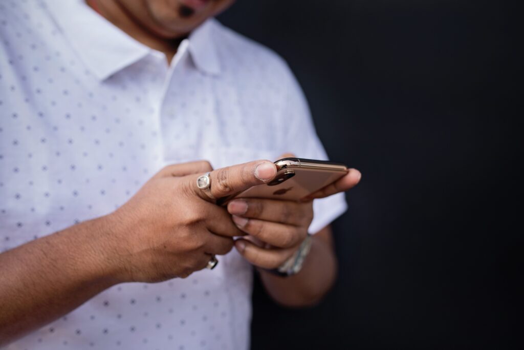 Man Browsing Smartphone Free Stock HD Photo