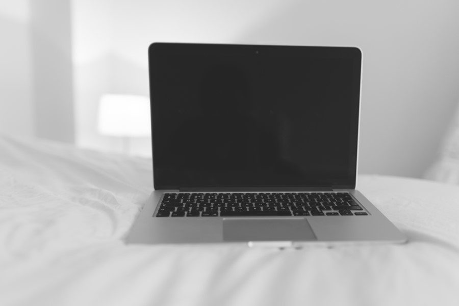 Laptop on Bed Free Stock HD Photo