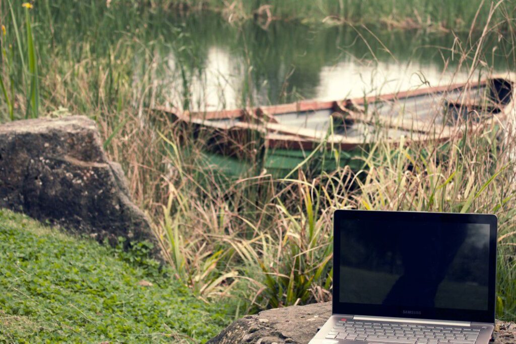 Laptop Computer Near Lake Free Stock HD Photo