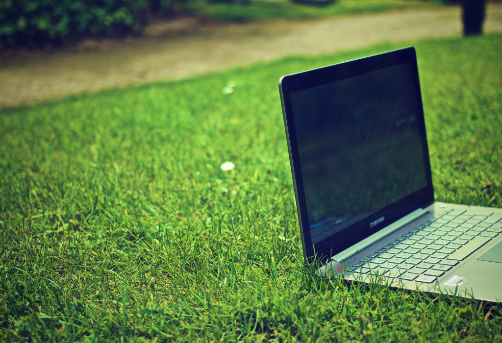 Laptop Computer on Grass Free Stock HD Photo