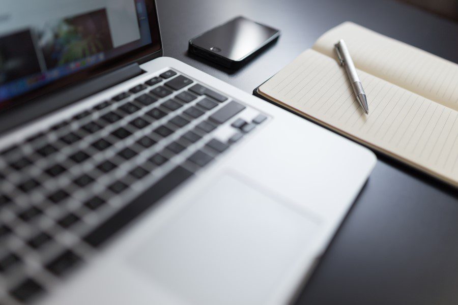 Laptop & Notepad on Desk Free Stock HD Photo