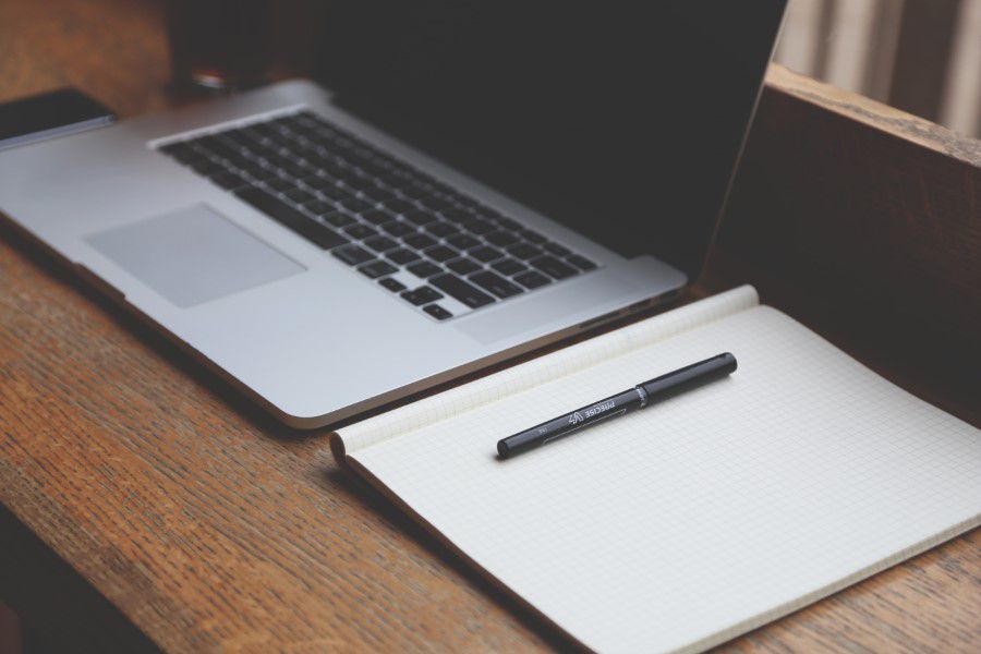 Laptop, Notepad & Pen on Desk Free Stock HD Photo