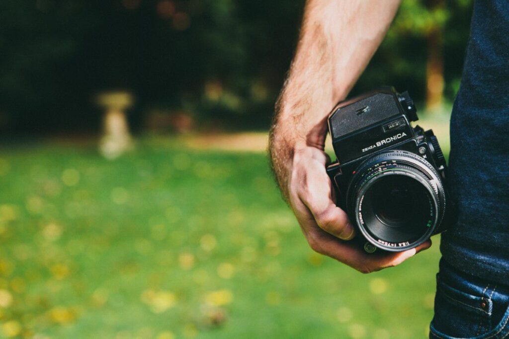 Man Holding Camera Free Stock HD Photo