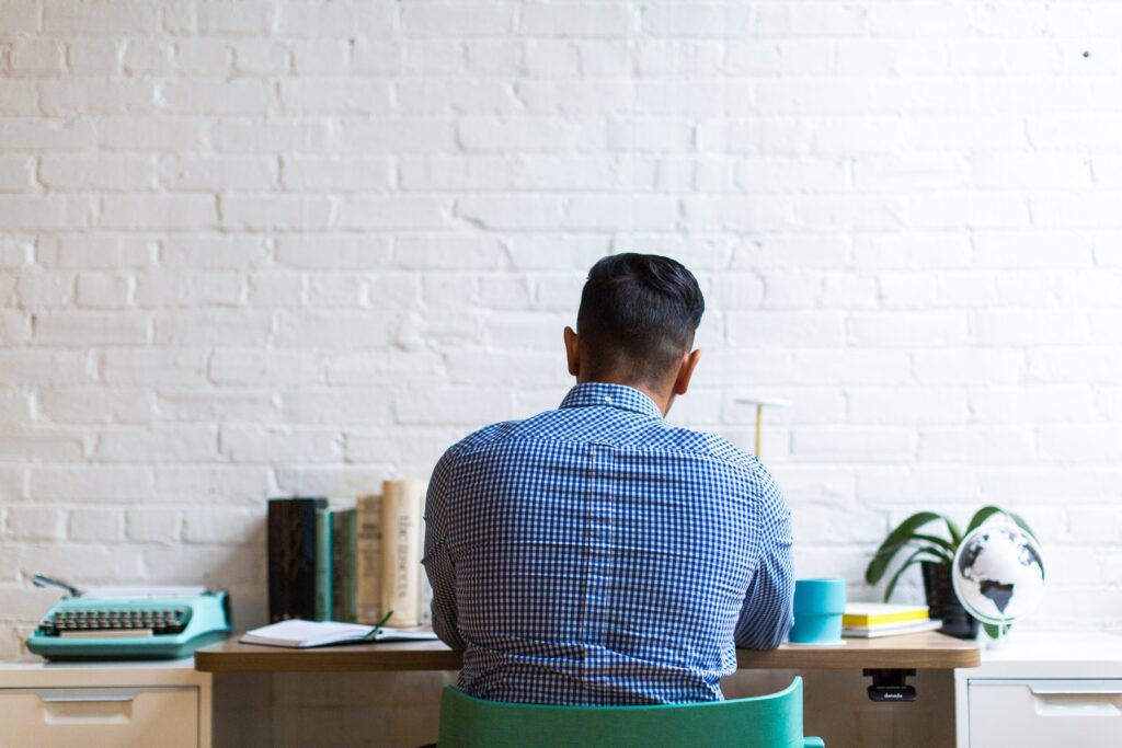 Man Working at a Desk Free Stock HD Photo