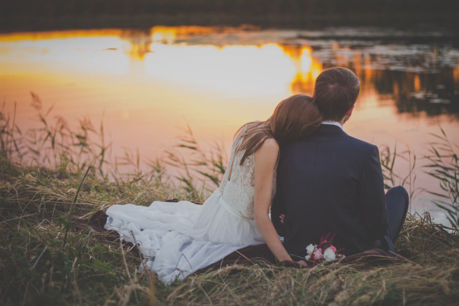 Wedding Couple on Grass at Sunset Free Stock HD Photo