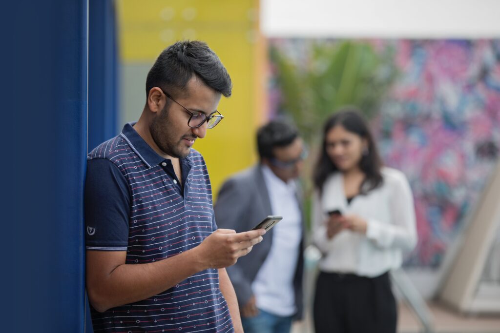 People Browsing Phone Free Stock HD Photo