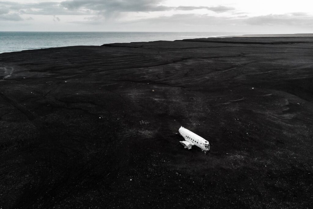 Plane on The Black Sand in Iceland Free Photo