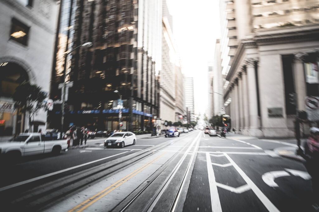 Police Car Racing Through The Big City Streets Free Photo