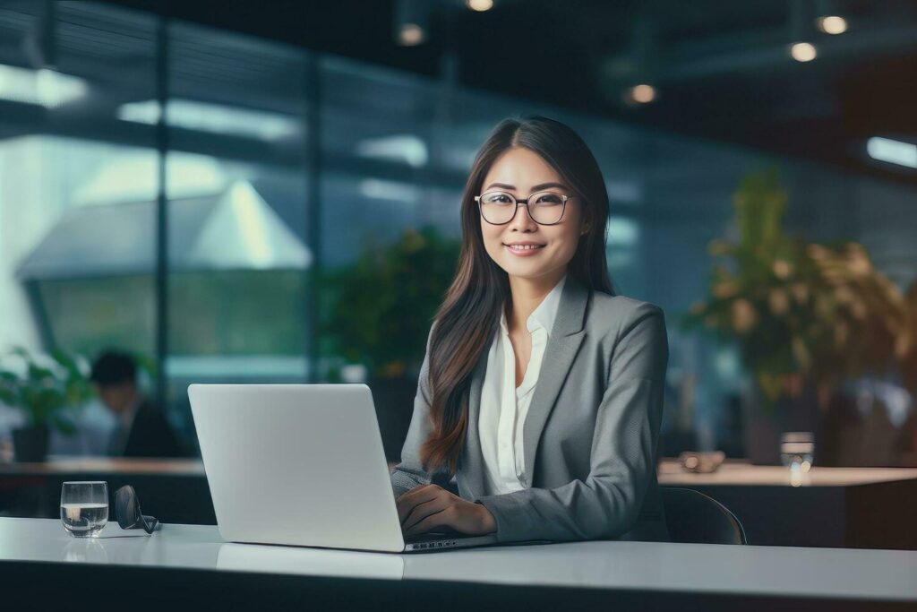 Portrait of a Beautiful Businesswoman in Modern Office, Asian Manager Looking at Camera and Smiling, Confident Female CEO Planning and Managing Company. Stock Free