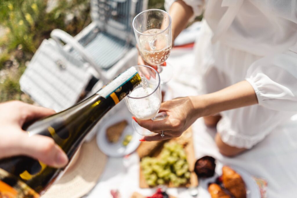 Pouring Prosecco into Picnic Glasses Free Photo