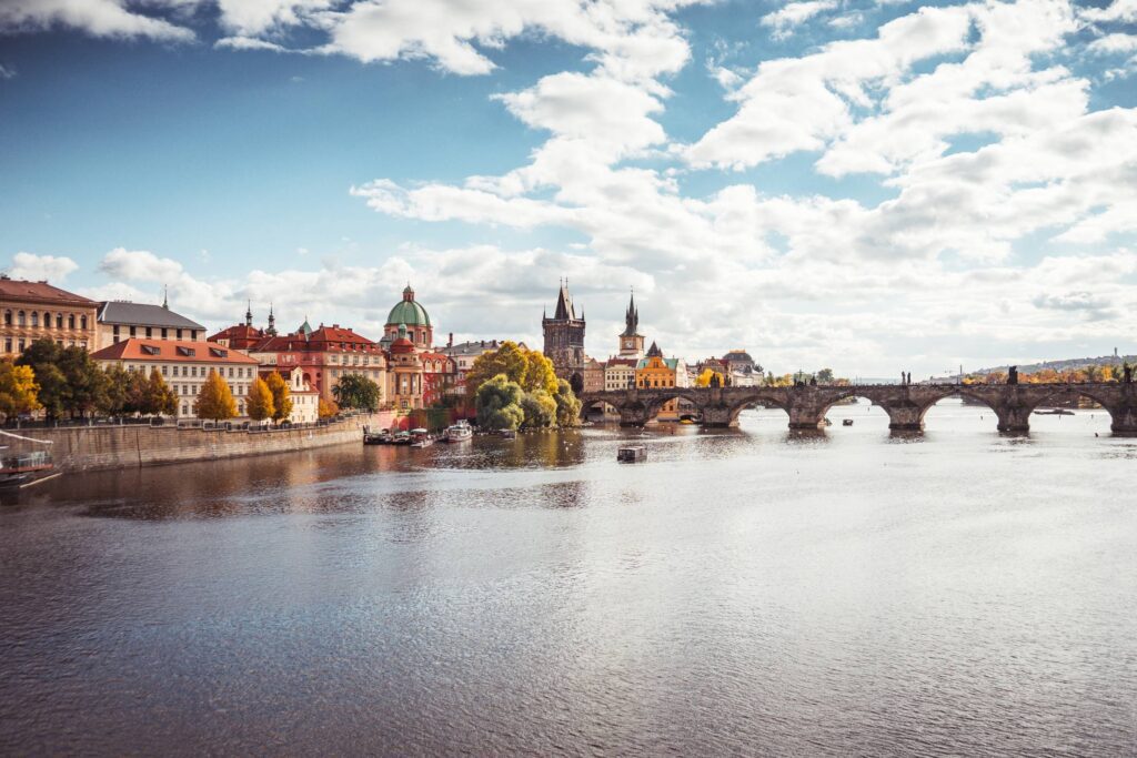 Prague Vltava River and Charles Bridge in Autumn Free Photo