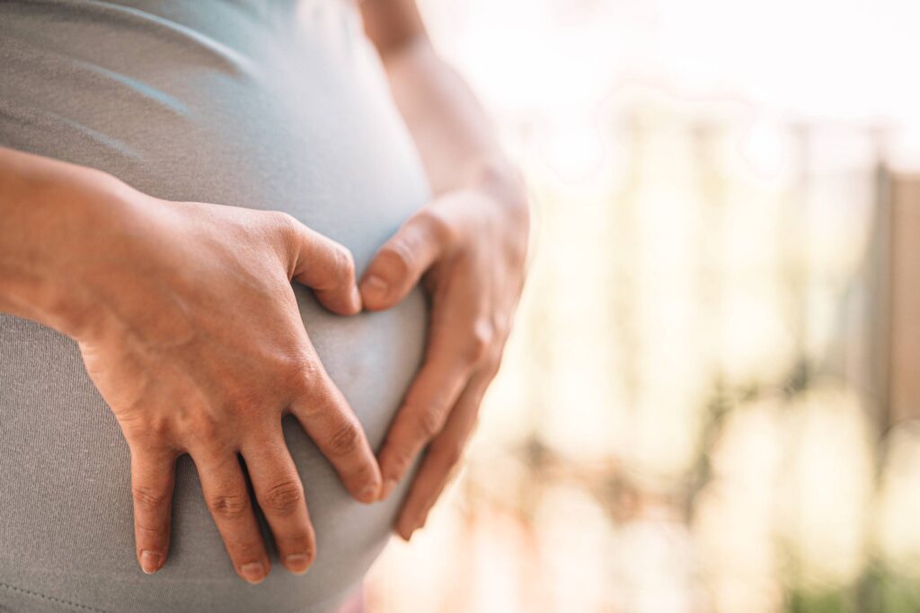 Pregnant Woman Makes Heart on Her Tummy Free Photo