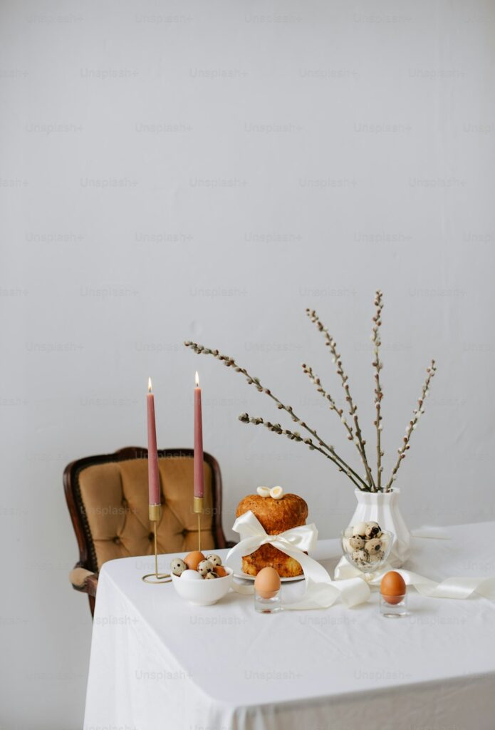 a table topped with a vase filled with flowers