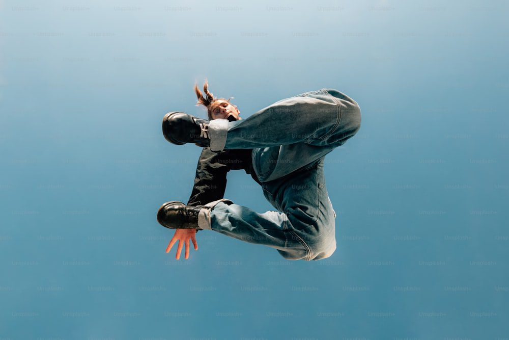 a man flying through the air while riding a skateboard