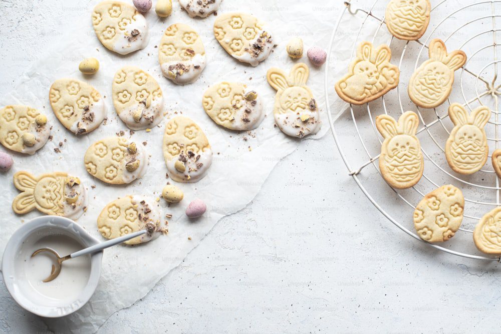 a plate of cookies with bunny ears and marshmallows