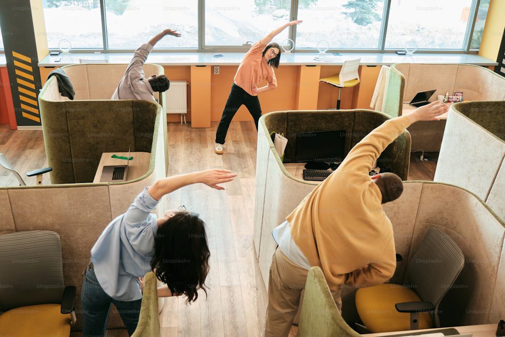 a group of people standing in a room next to each other