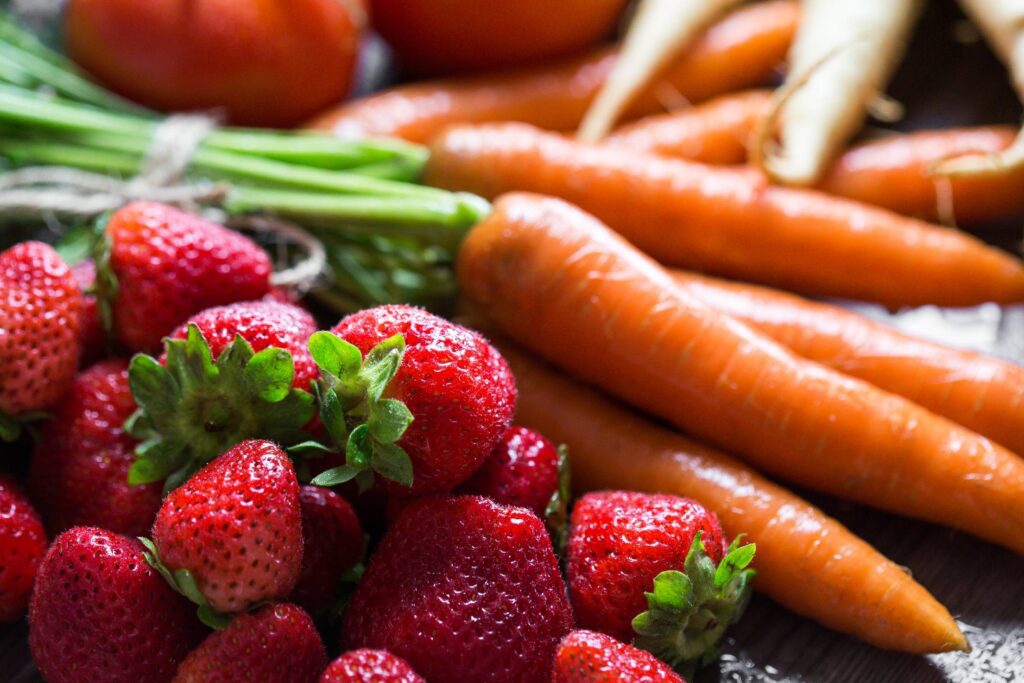 Preparing Fresh Breakfast: Strawberries & Carrots Free Photo