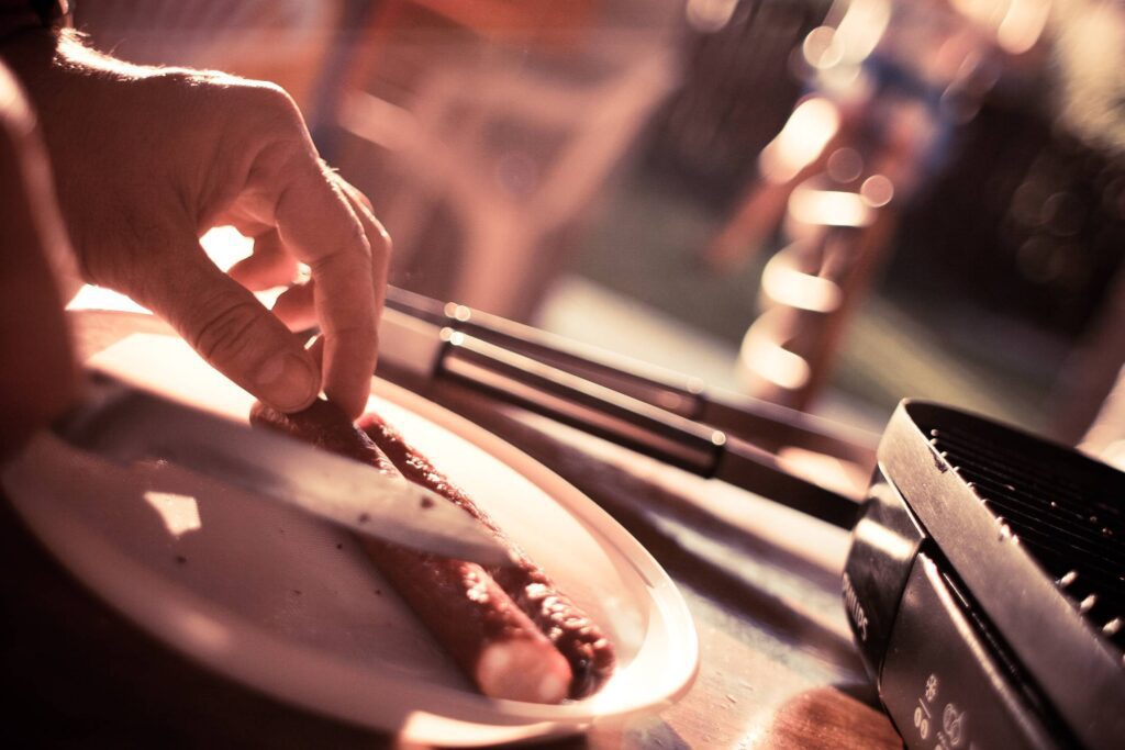 Preparing Sausages for Grill Free Photo