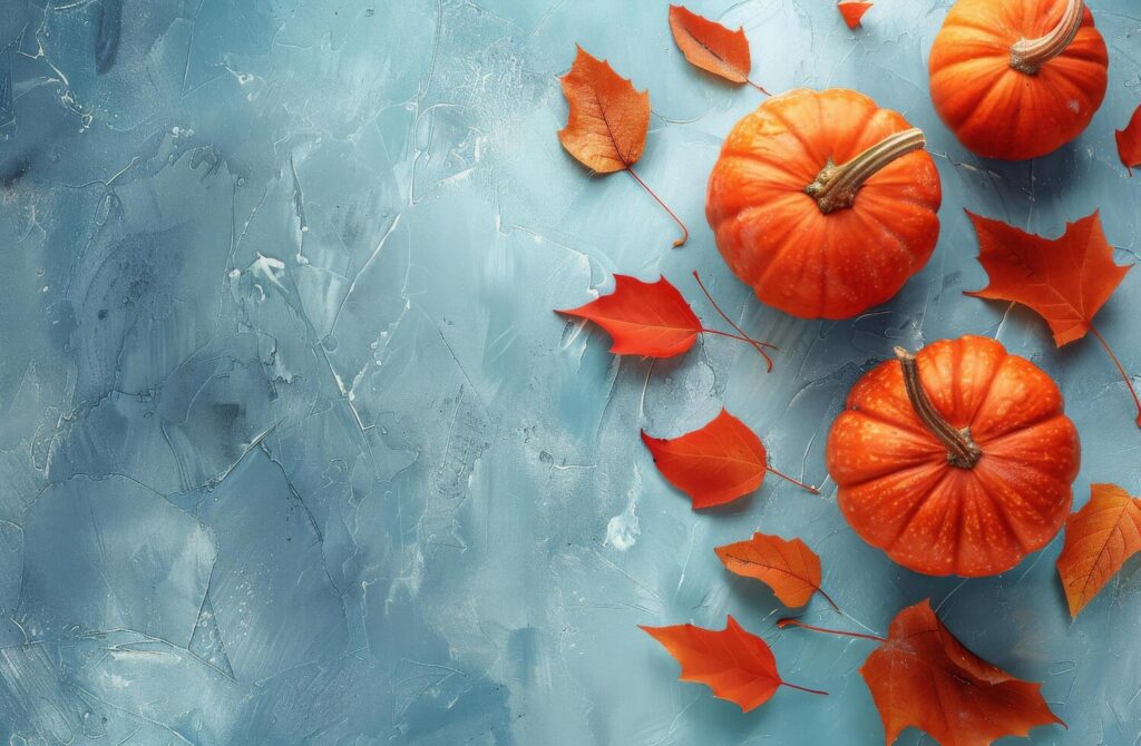 Pumpkins and Leaves Painting on Blue Background Stock Free