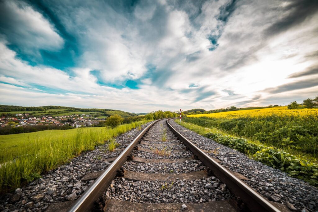 Railway Road in The Middle of a Field Free Photo