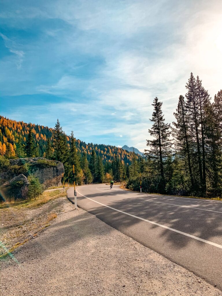 Random Road with a Cyclist in Dolomites, Italy Free Photo