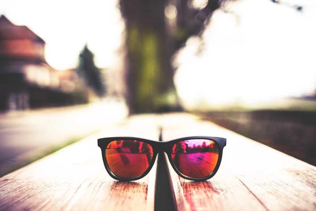 Red Fashion Glasses on Wooden Table Free Photo