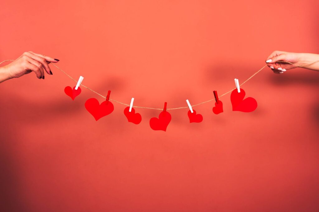 Red Hearts Hanging on a String Free Photo