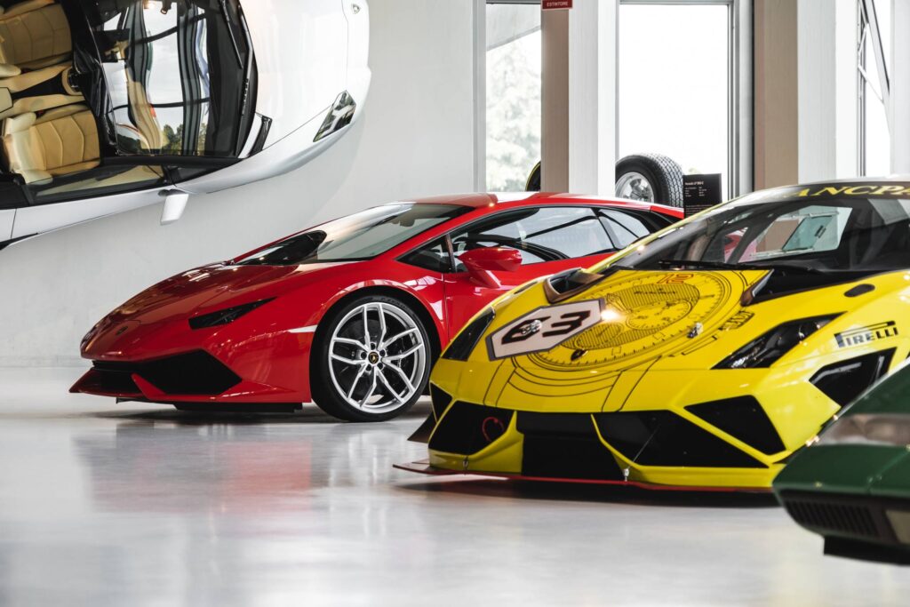 Red Huracán and Yellow Racing Gallardo in Lamborghini Museum Free Photo