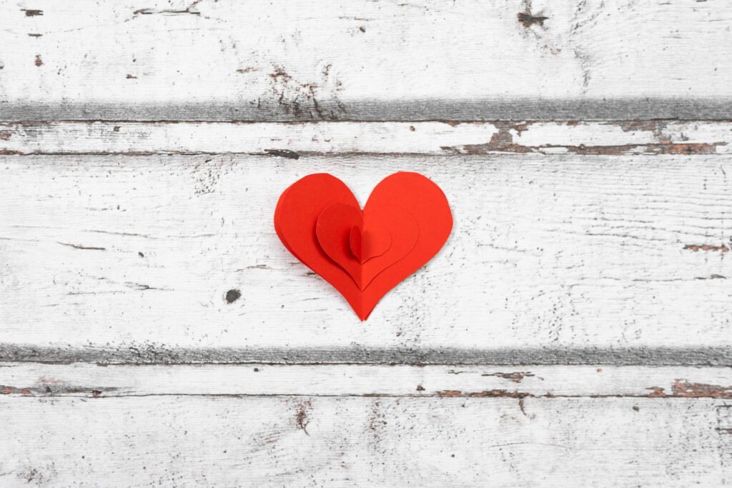 Red Paper Heart on a White Wooden Background Free Photo