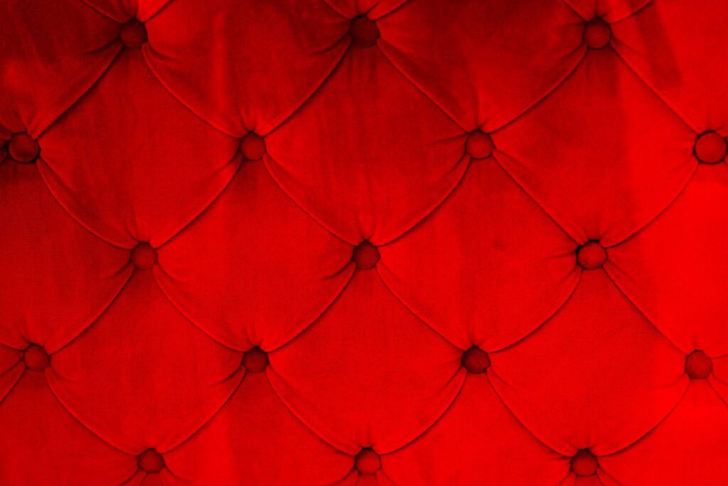 Red Sofa Texture Material Button Upholstery Design Close Up Free Photo