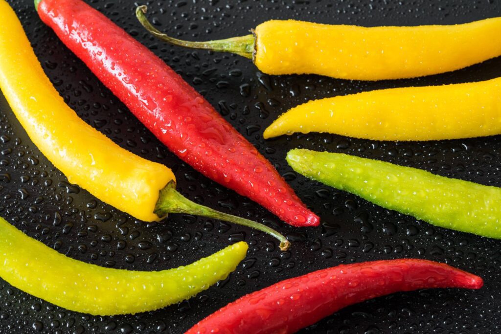 Red, Yellow and Green Colorful Chilli Peppers Free Photo