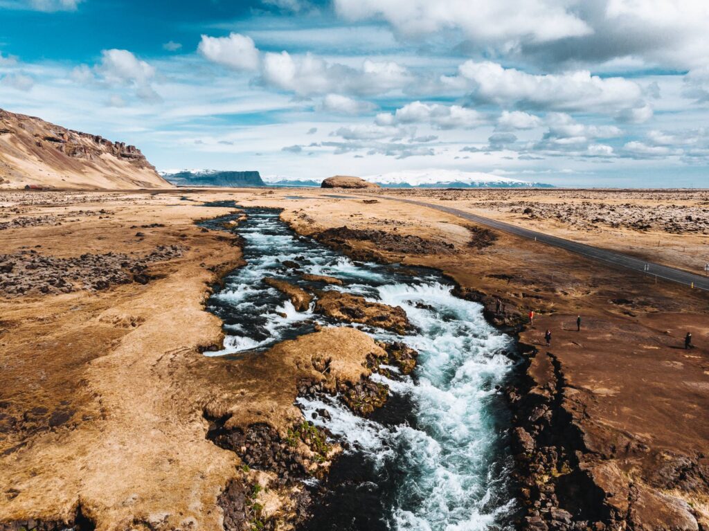 River and Small Waterfalls Along the Road on Iceland Free Photo