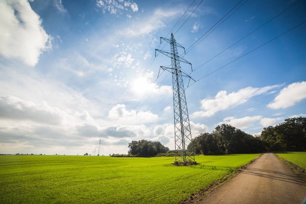 Road Under Power Line Electricity Pylons Free Photo