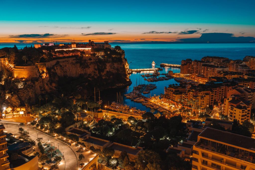 Rock of Monaco (Le Rocher) and Parts of Monte Carlo and Fontvielle Harbors Before Sunrise Free Photo