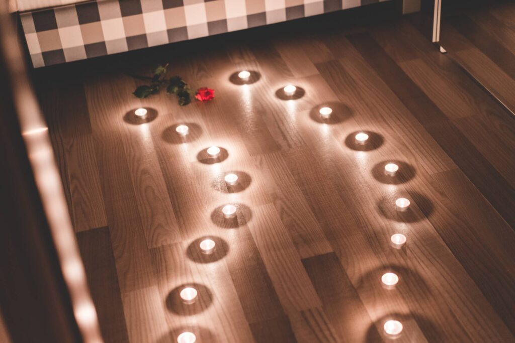 Romantic Candles as a Pathway in a Bedroom Free Photo