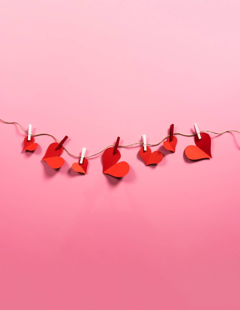 Romantic Love Paper Red Hearts Hanging on a String Free Photo