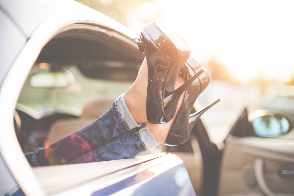 Sexy Woman Legs on High Heels Out of Car Windows Free Photo