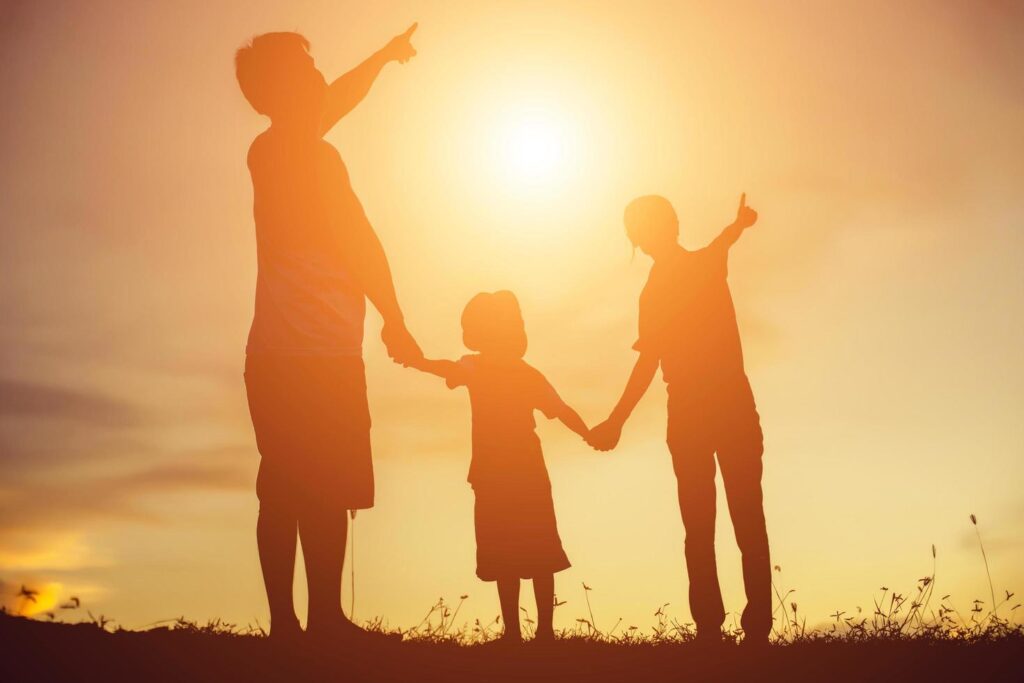 silhouette of a happy family and happy time sunset Stock Free