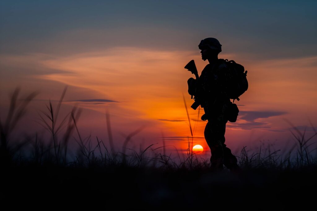 Silhouette of a Soldier in the Evening Against the Setting Sun Stock Free