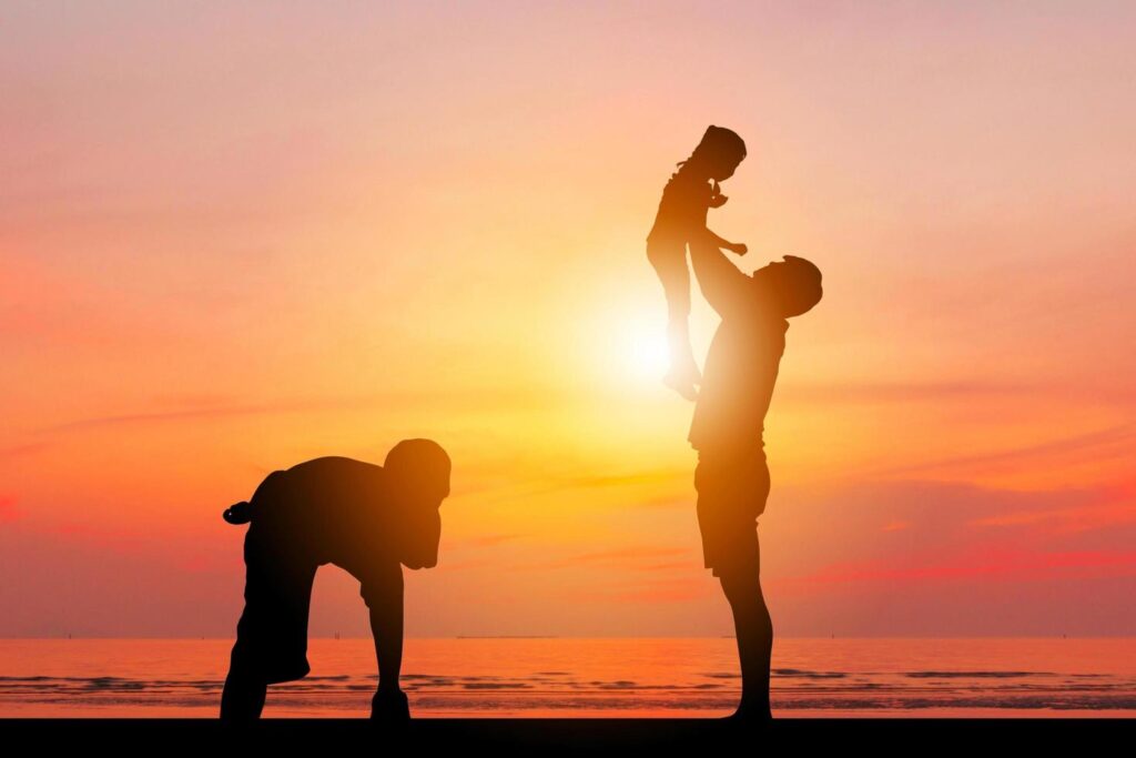 Silhouette of Father and two kids having fun on sunset, Happy family concept. Free Photo