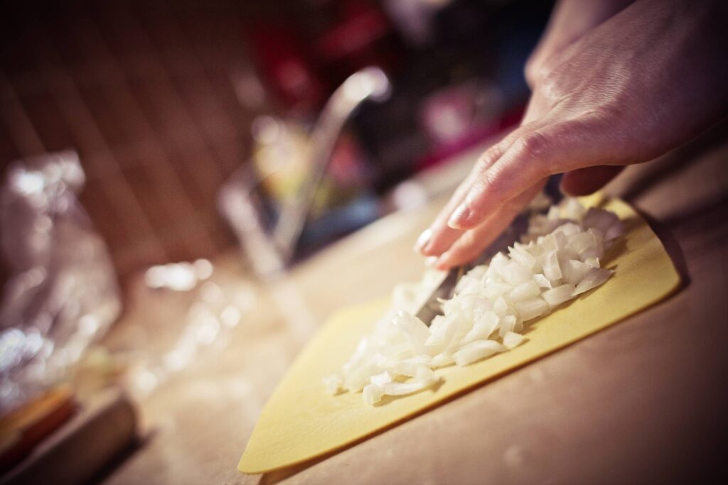 Slicing Onions in the Kitchen Free Photo