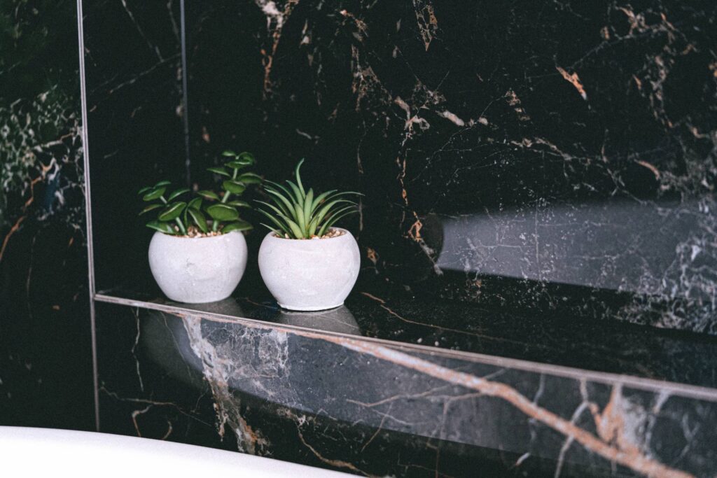 Small Concrete Flower Pots Decorations in Black Marble Bathroom Free Photo