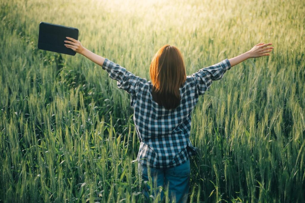 Smart farm. Farmer with tablet in the field. Agriculture, gardening or ecology concept. Harvesting. Agro business. Stock Free