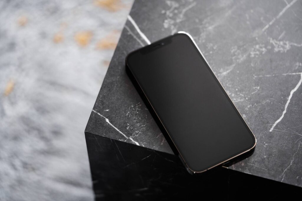 Smartphone on Black Marble Table Free Photo