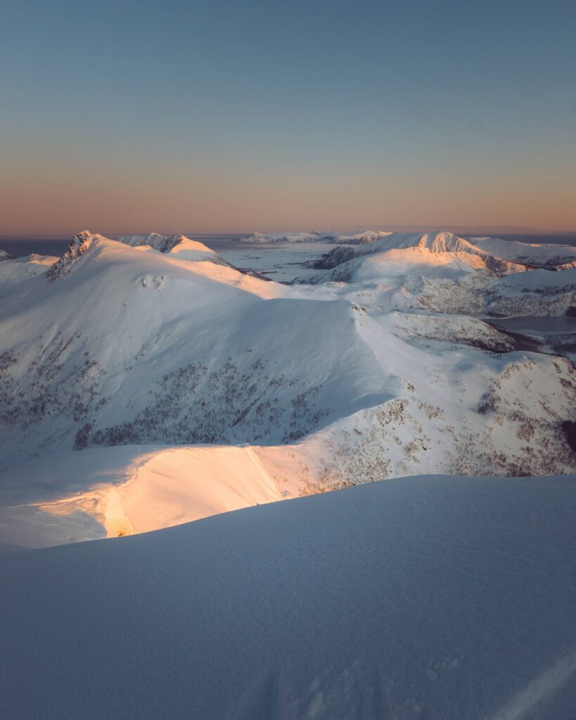 Snowy Mountain Peaks in Sunrise Light Free Photo