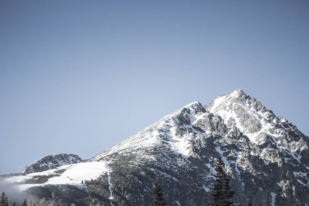 Snowy Mountain with Blue Cloudless Sky Free Photo