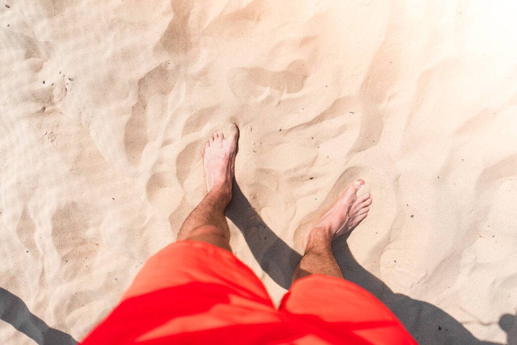 Standing in Sand on Summer Beach Free Photo