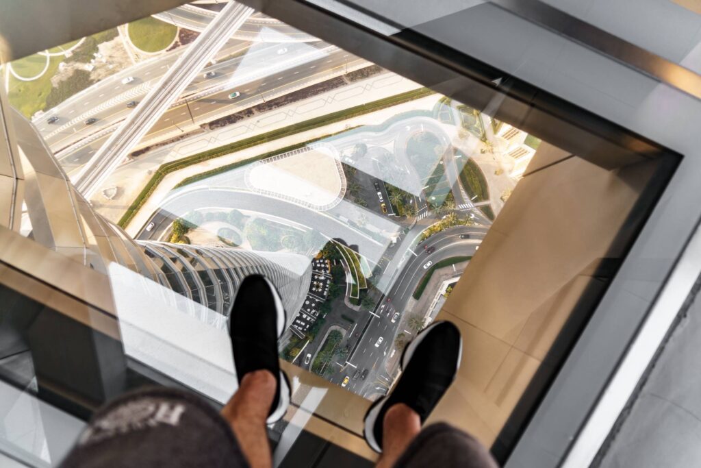 Standing on the Glass Floor at Dubai Sky Views Observatory Free Photo