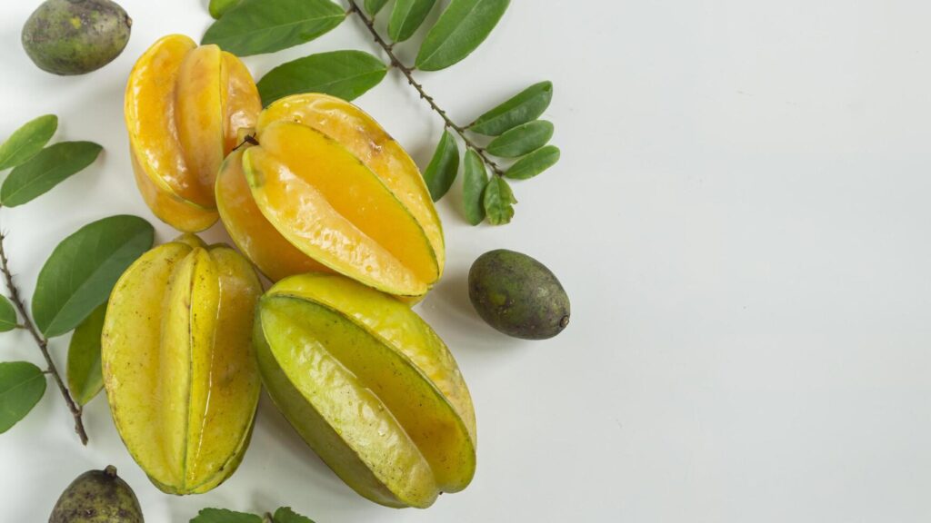 star fruit and leaves on white background Stock Free